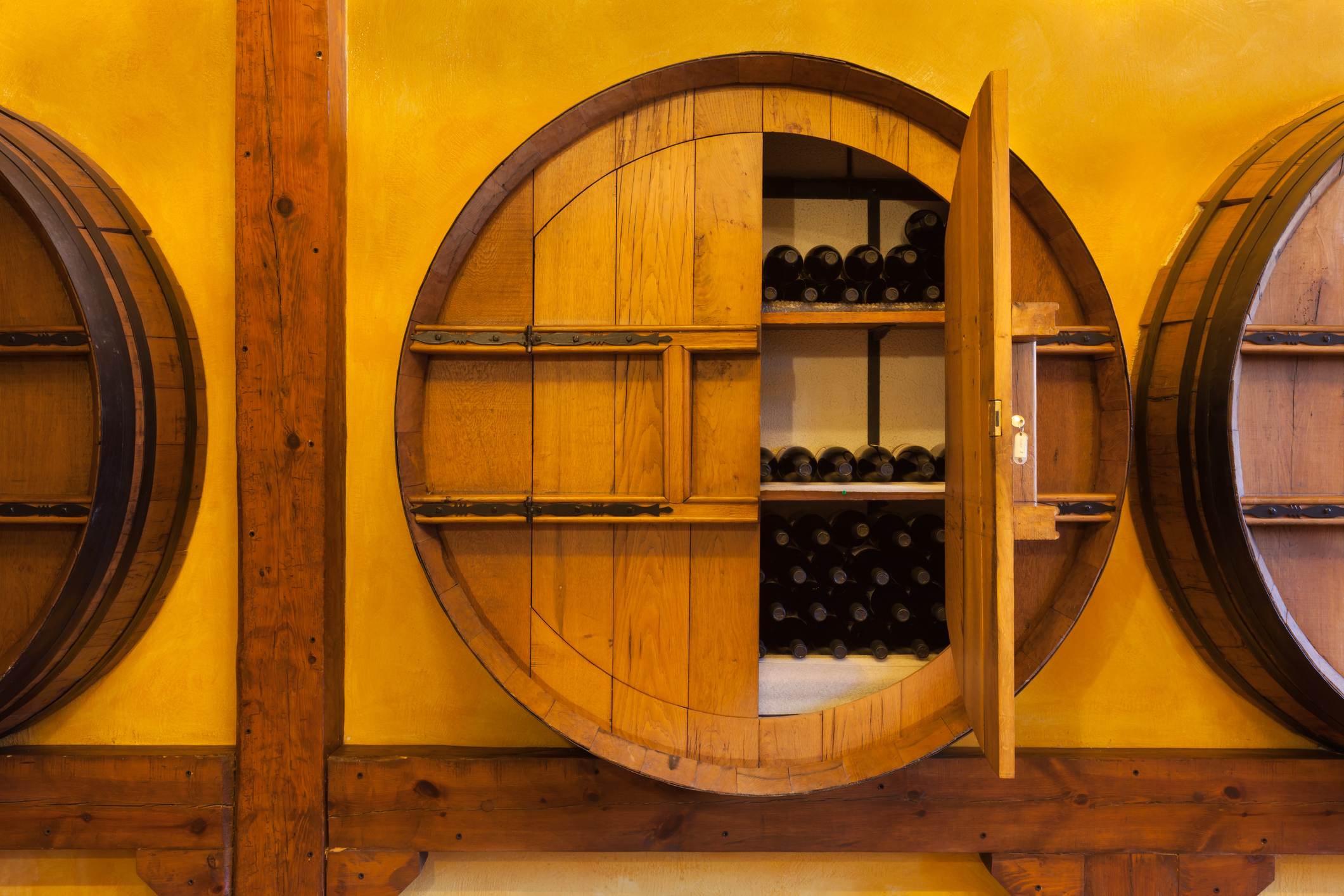 Barrel with wine bottles